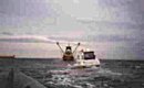 "Optimist" taken in tow after the water leak is fixed.