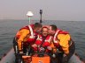 Helmsmen Mark Greaves and Andy Stonehouse congratulate crewman